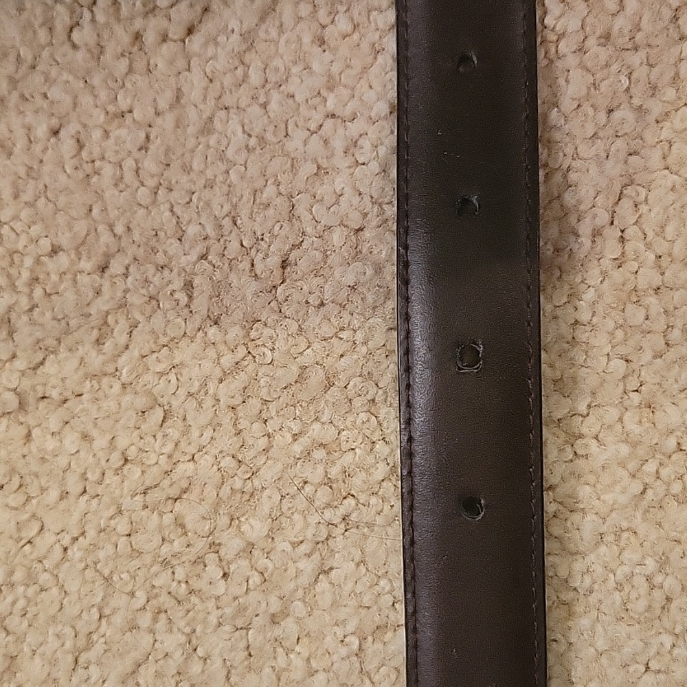 Reversible 30" belt.  Black/dark brown. Holes/25,26,27,28 inch waist. Silver bkl